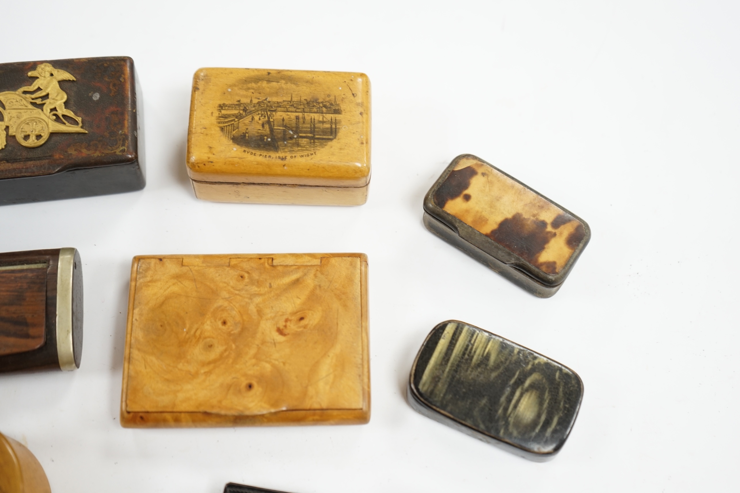 Ten 19th century and later snuff boxes, one mounted with gilt metal chariot scene, and two Mauchlineware boxes, largest chariot scene box 10cm wide. Condition - fair for use and age